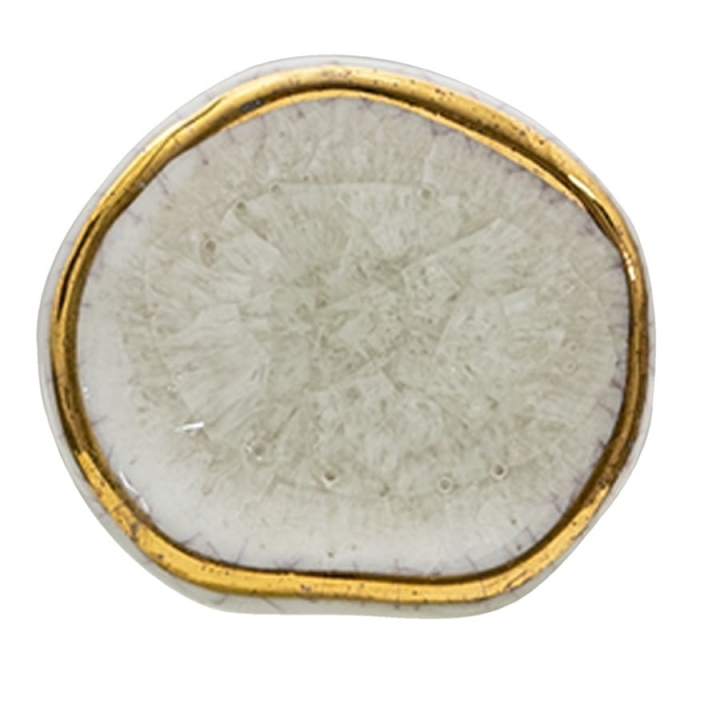 Biała gałka do mebli ze złotą otoczką